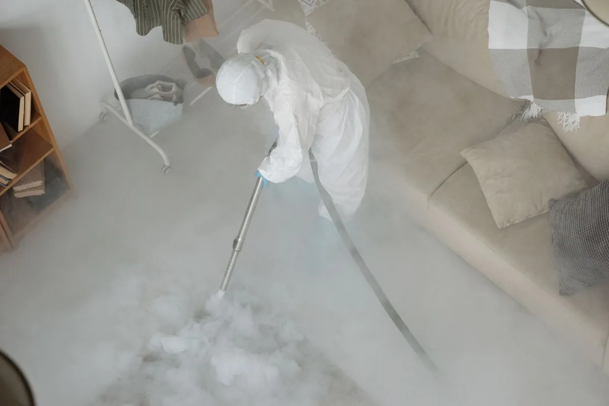 Biohazard cleanup technician in protective equipment, Seneca, KS